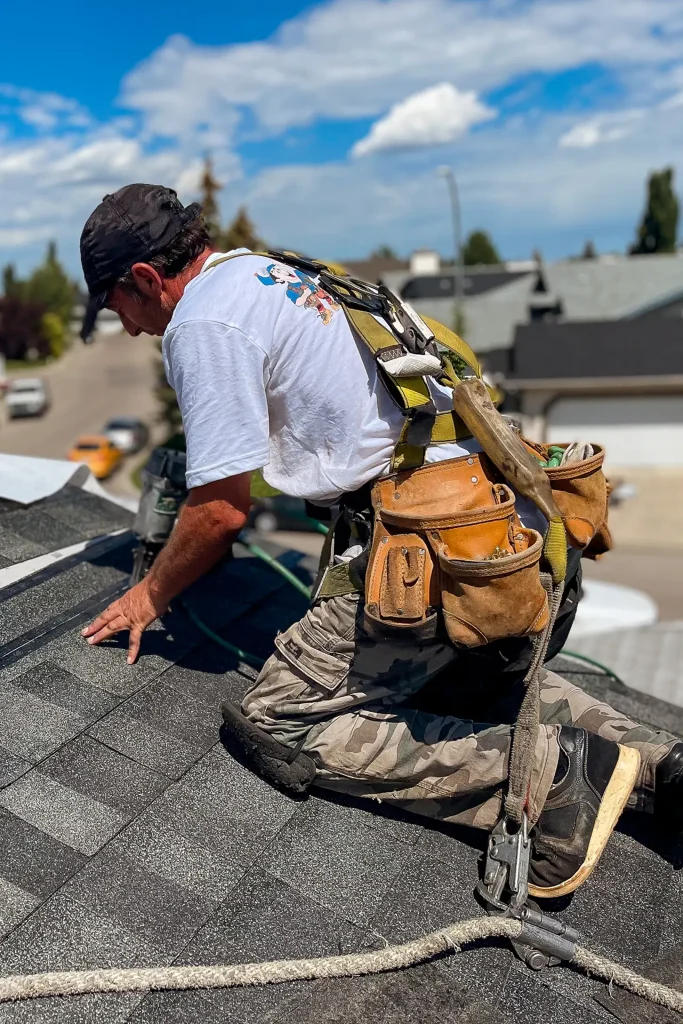 How Long Does a Roof Last? 2 lincoln exteriors roofing man on roof